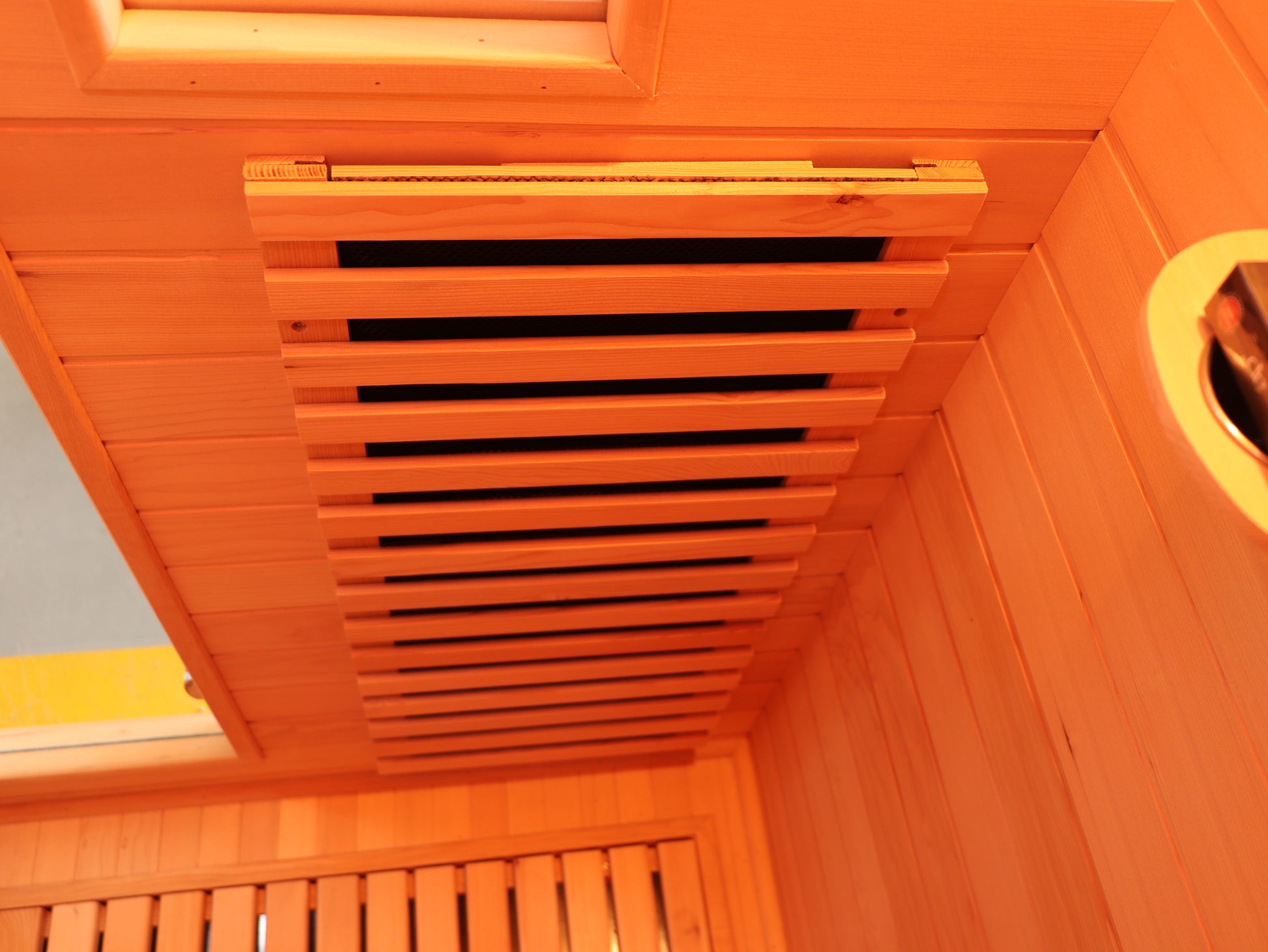 Wooden sauna interior with a closed door